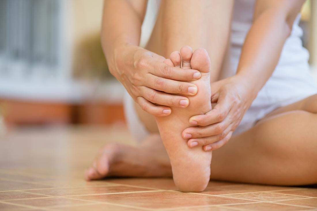 a-woman-with-a-pain-in-arch-of-foot.jpg