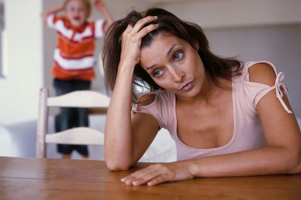 Portrait-of-a-young-mother-stressed-out-by-her-son.jpg